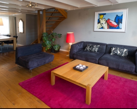 Living Room with the View of Dining Are and Stairs Singel apartment Amsterdam