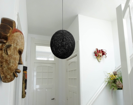 3rd floor hallway decorated with a pair of tribal masks