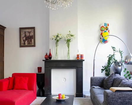 Focal point in the living room is our red chaise lounge