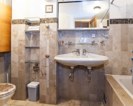 Full tub, shower, double sink, toilet, italian tile