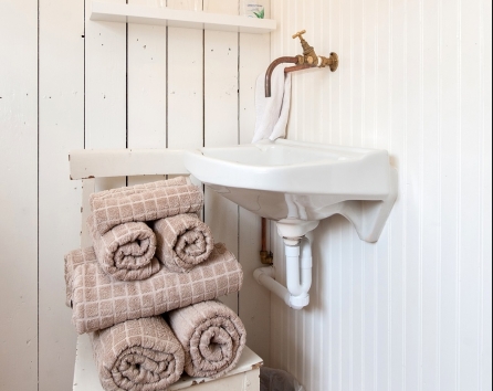 Guest bedroom with washing, towels provided as well as hairdryer